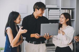 Financial analysts analyze business financial reports on a digital tablet planning investment project during a discussion at a meeting of corporate showing the results of their successful teamwork. photo