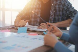 Team of business people working together in the meeting room office, teamwork background charts and graphs banner, double exposure successful teamwork,business planning concept. photo