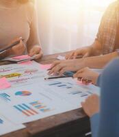 Team of business people working together in the meeting room office, teamwork background charts and graphs banner, double exposure successful teamwork,business planning concept. photo