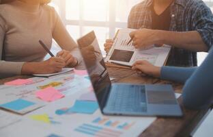 Team of business people working together in the meeting room office, teamwork background charts and graphs banner, double exposure successful teamwork,business planning concept. photo