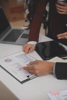 Audit concept,Administrator business man financial inspector and secretary making report calculating balance. Internal Revenue Service checking document. photo