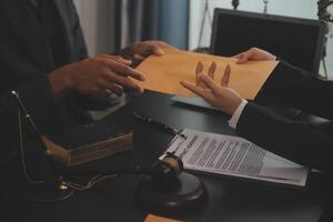 Law theme, gavel or mallet of the judge, lawyer enforcement officers, evidence-based cases taken into account in the court abount business, legislation. photo