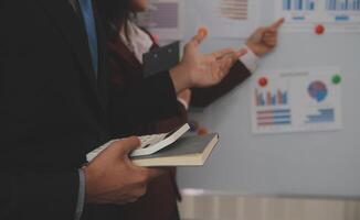 Audit concept,Administrator business man financial inspector and secretary making report calculating balance. Internal Revenue Service checking document. photo