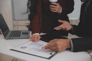 Audit concept,Administrator business man financial inspector and secretary making report calculating balance. Internal Revenue Service checking document. photo