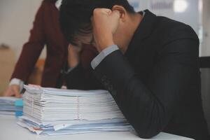Audit concept,Administrator business man financial inspector and secretary making report calculating balance. Internal Revenue Service checking document. photo