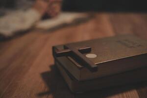 Christian group are praying to god with the bible and sharing the gospel. Concept of faith for god. photo