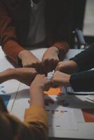 Hand join together for work togetherness, Hand stack for business and service, Team volunteering or teamwork. Concept connection of community and charity. Group of business workforce participation. photo