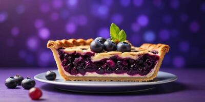 Slice of blueberry fruit pie on violet background. photo
