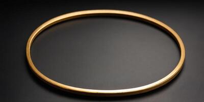A single golden circular frame sits on a black background. photo