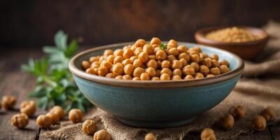 Bowl of chickpeas on a rustic surface with burlap. photo