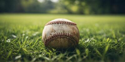 A baseball rests on a lush green grass field. photo