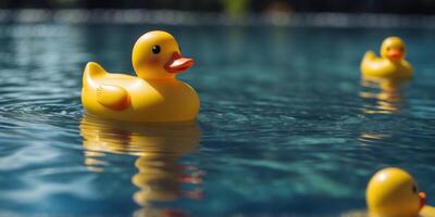 Yellow rubber duck floating in a clear blue pool Fun and playful summer vibe. photo