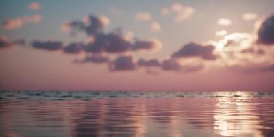 Close-up of a calm ocean surface with sparkling reflections and fluffy pink clouds in the sky The light creates a dreamy and serene atmosphere. photo