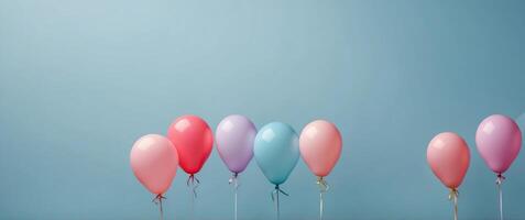 Creative minimal concept with flaying pink balloons and kitchen fork on pastel blue background Flat lay design. photo