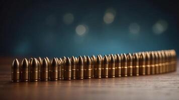 A row of bullets are lined up on a table. photo