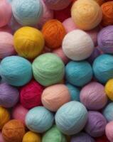 Bunch of wool balls in pastel color background. photo