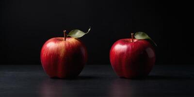 Three red apples are shown in a row on a black background. photo