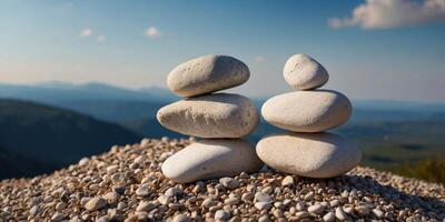 Three white rocks are stacked on top of each other on a gravel path. photo