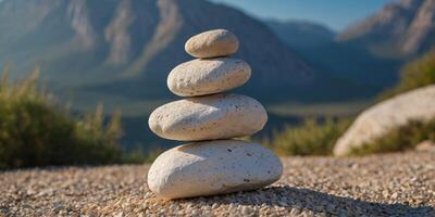 Three white rocks are stacked on top of each other on a gravel path. photo