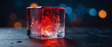 An cube made of ice with a red glow on it. photo