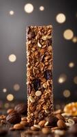 Close up of Chocolate Coated Crunchy Granola Bar with Visible Nuts and Dried Fruit. photo