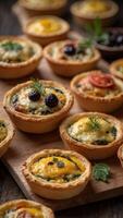 Delectable Mini Quiches with Assorted Fillings Displayed on a Rustic Wooden Serving Platter Baked Pastries and Breads Concept. photo