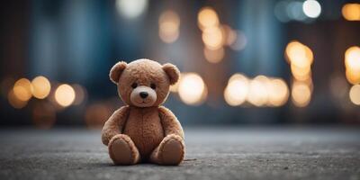 abandoned teddy bear on the background of building. photo