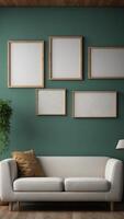 A white couch sits in front of a green wall with two empty picture frames. photo