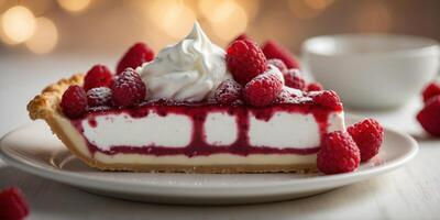 a piece of pie with raspberries and whipped cream. photo