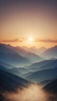 A mountain range where the peaks glow in the dark and the valleys are filled with mist. photo