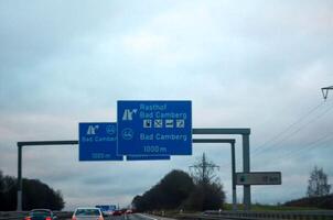 Sign on the highway in the cloudy day photo