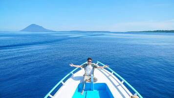 Man on a Boat Enjoying the Ocean View photo