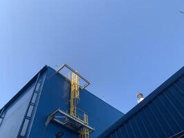 Turbine building with a yellow ladder photo