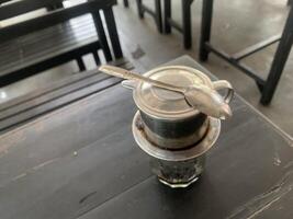 Vietnamese Coffee Maker on a Table photo