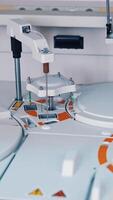 Modern robotic machine of checking blood samples in process in the laboratory. Analysis of liquid at medical clinic. Reseach and science concept. Slow motion. Vertical video