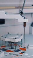 Functional medical laboratory with biochemical analyzer in it. Working process of automated machine in a laboratory. Chemical and biological laboratory of examining blood. Vertical video