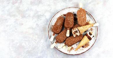 Stick ice cream, chocolate popsicle. photo