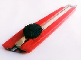 Close up horizontal shot of red cutting tool, white background,Taking photos from a high angle