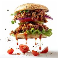 a sandwich with meat, lettuce, tomatoes and onions photo