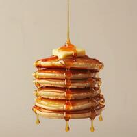 a stack of pancakes with syrup dripping from them photo