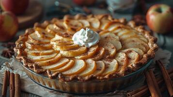 a pie topped with sliced apples and whipped cream photo