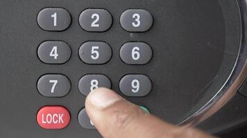 A person is pressing a button on a keypad video