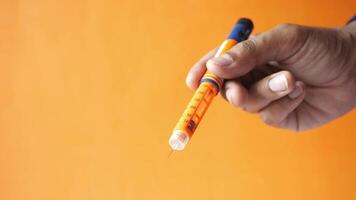 A person holding a pencil with a sharpener video