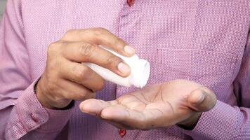 A man is holding a white object in his hand video