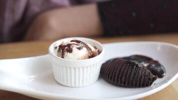A plate with a chocolate cake and ice cream video