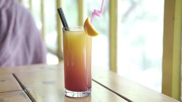 A colorful drink with a straw and a straw video