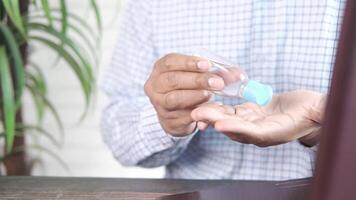 A man holding a small bottle of eye drops video