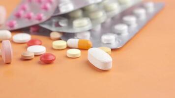 Many different types of pills and tablets on a table video