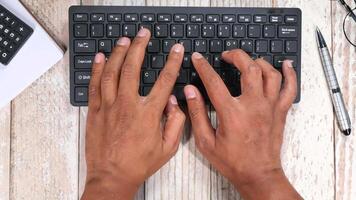 Hands typing on a keyboard video