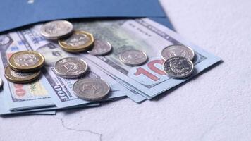 Money in a blue envelope with a hole in it video